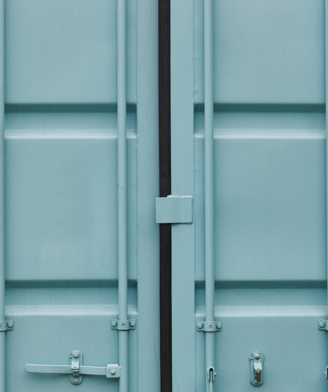 Cargo container doors in blue green tone. Delivery background. Horizontal